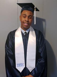 Daniel Doby in graduation cap and gown